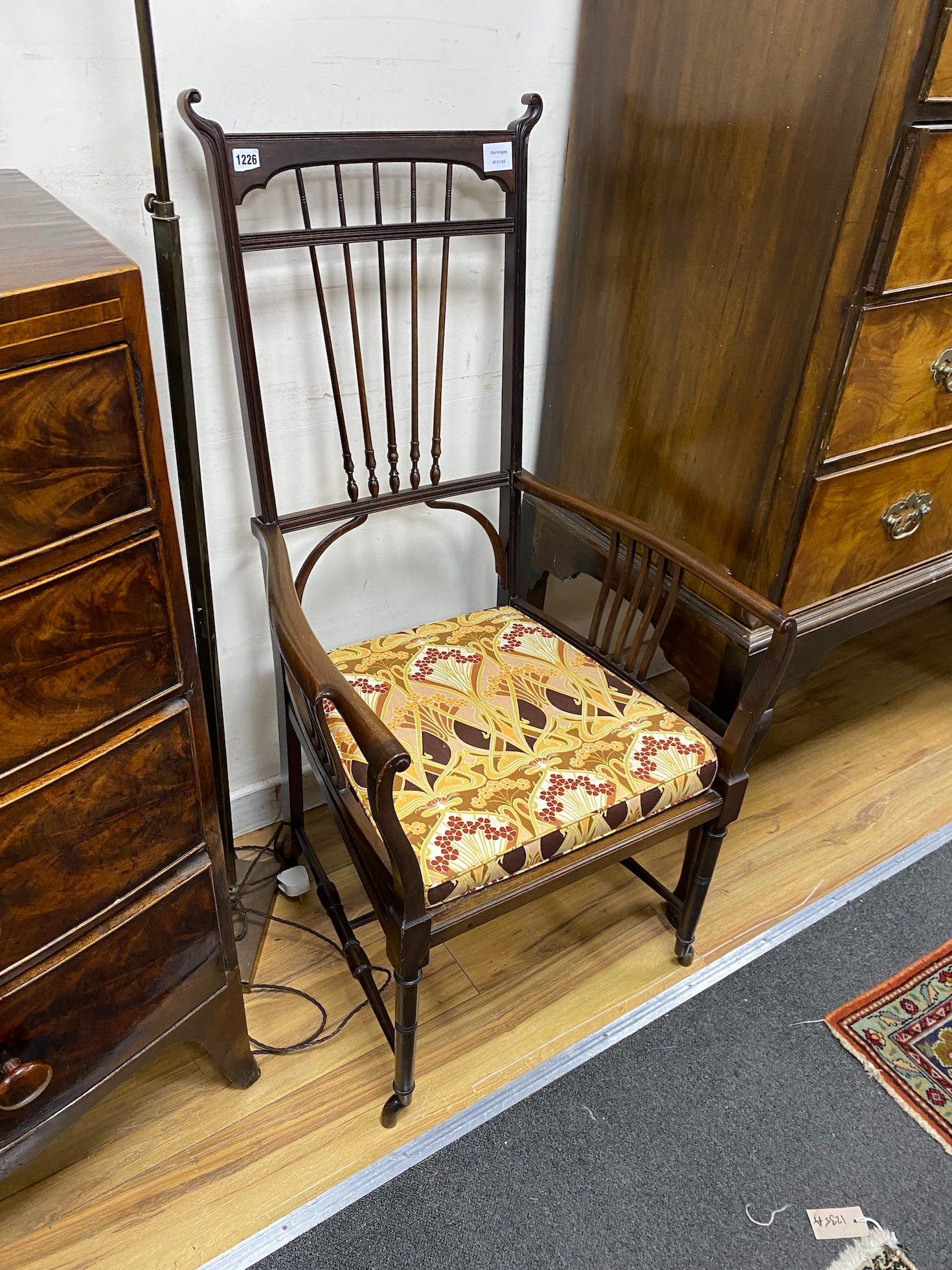 In the style of Charles Rene Mackintosh, an Edwardian mahogany elbow chair with upholstered drop-in seat, width 59cm, depth 46cm, height 115cm